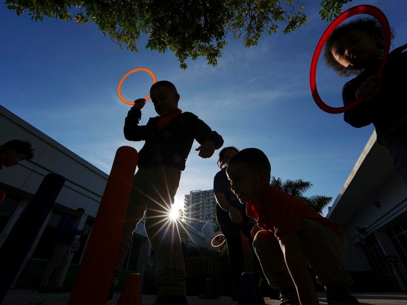 Children playing in silhouette